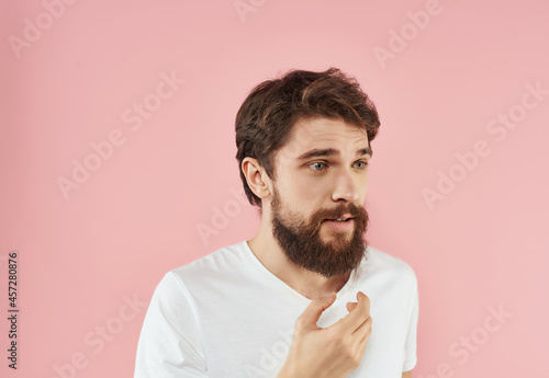 bearded man in a white t-shirt happy facial expression close-up