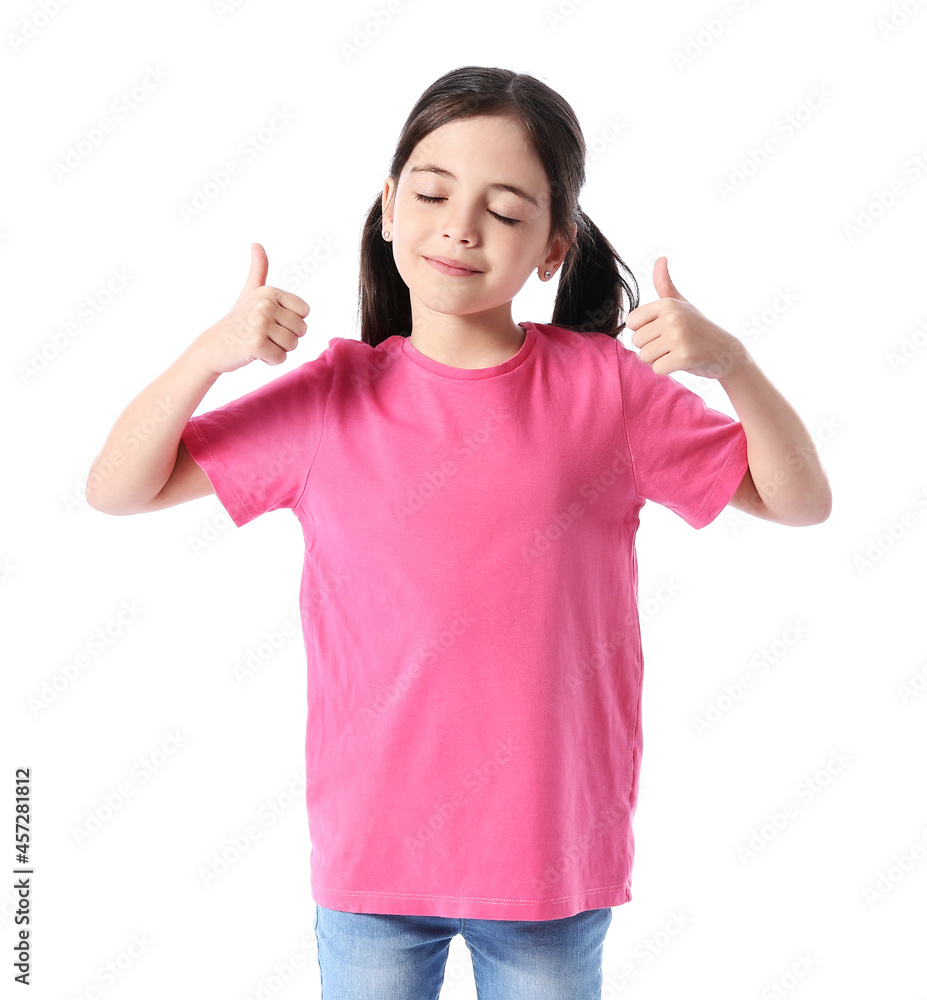 Little girl in stylish t-shirt showing thumb-up on white background Little girl in stylish t-shirt showing thumb-up on white background