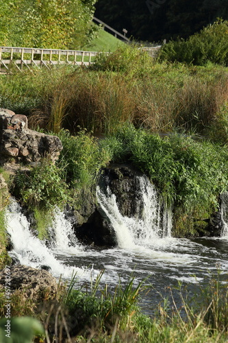 Ventas Rumba Waterfall and wooden bridges on the Venta river. Kuldiga, Latvia. High quality photo