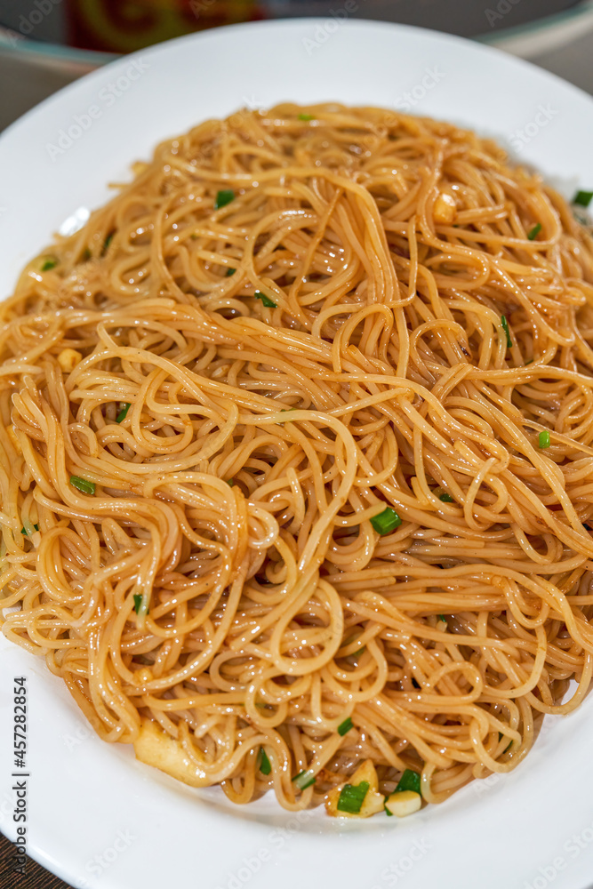 A delicious Chinese dish, dry fried round rice noodles A delicious Chinese dish, dry fried round rice noodles