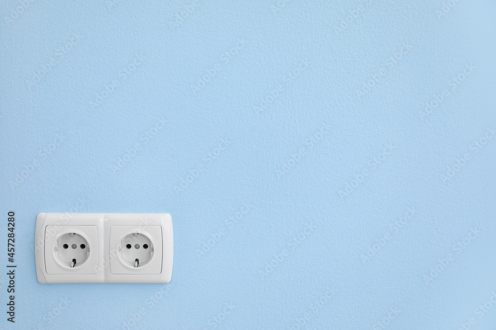 Electric socket on color wall Electric socket on color wall