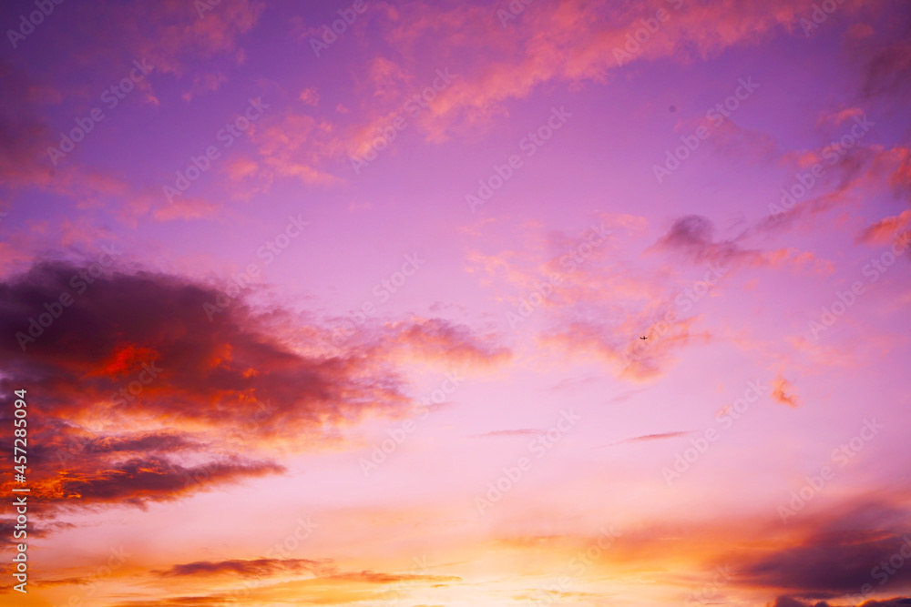 Colorful sunset. Purple red orange yellow sky with clouds. Beautiful evening sky background.