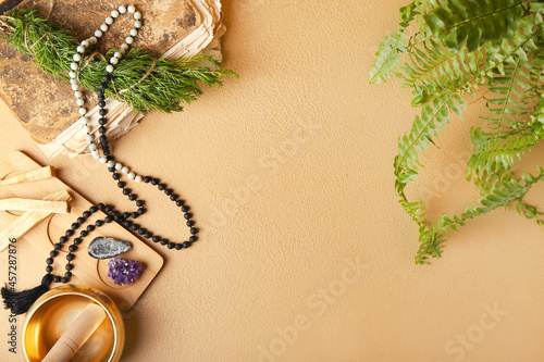 Canvas Print Composition with Tibetan singing bowl, gemstones, beads and Palo Santo on color