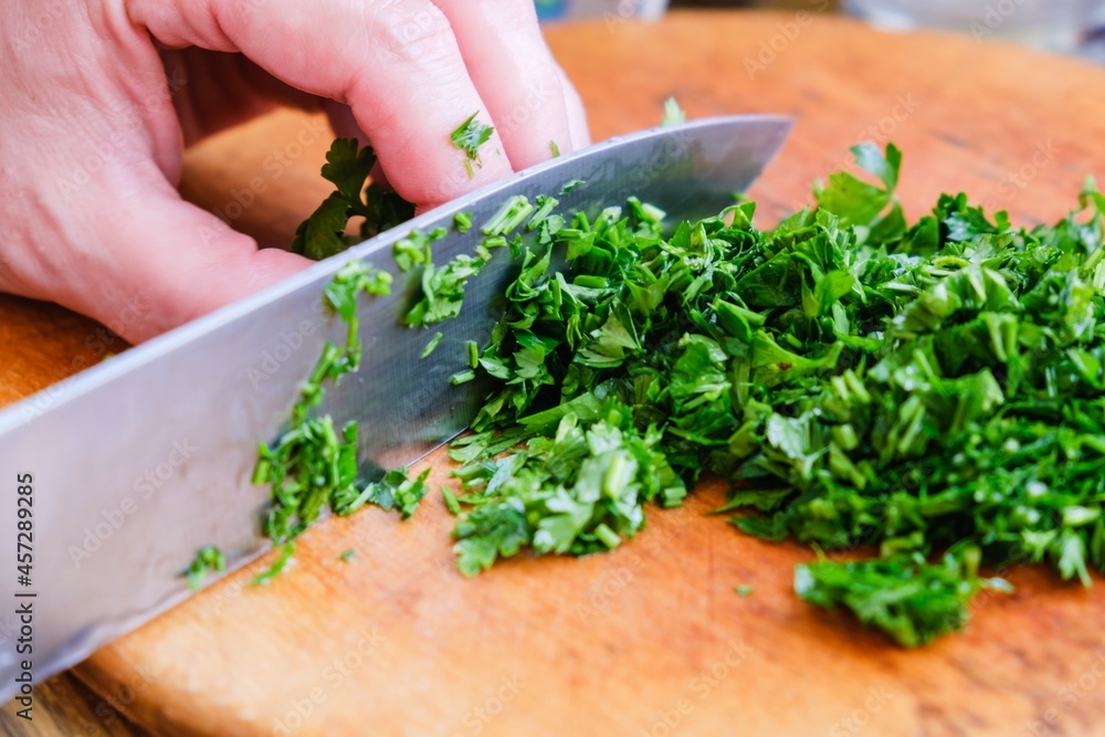 Parsley Cutting knife wooden board. raw cook. Parsley Cutting knife wooden board. raw cook.