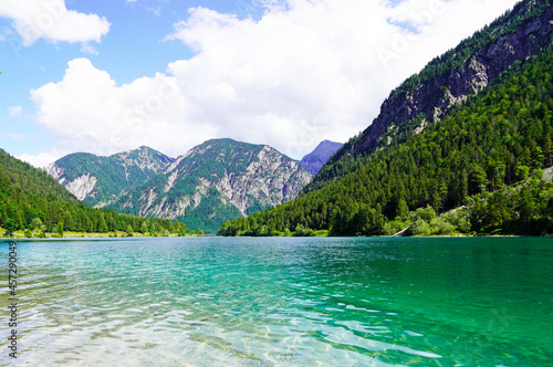 Landscape at the Plansee in Tyrol  Austria. Turquoise colored lake with surrounding landscape and mountains.