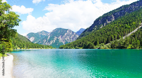 Landscape at the Plansee in Tyrol, Austria. Turquoise colored lake with surrounding landscape and mountains.