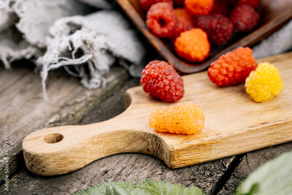 Fresh juicy raspberries in a wooden table. Summer still life with raspberries. A place to copy Fresh juicy raspberries in a wooden table. Summer still life with raspberries. A place to copy