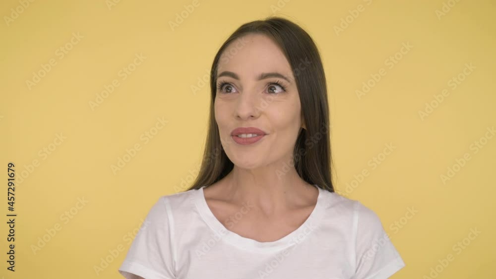 close up. Exotic woman 40 years old long-haired lady happy shocking and amazed. Studio on yellow background isolated. close up. Exotic woman 40 years old long-haired lady happy shocking and amazed. Studio on yellow background isolated.