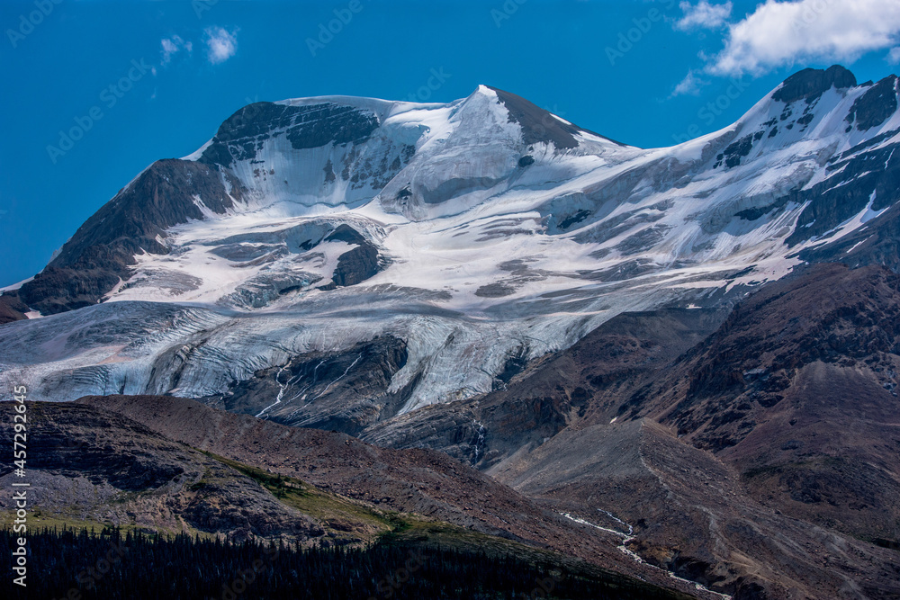 Glacier with snow covered mountains