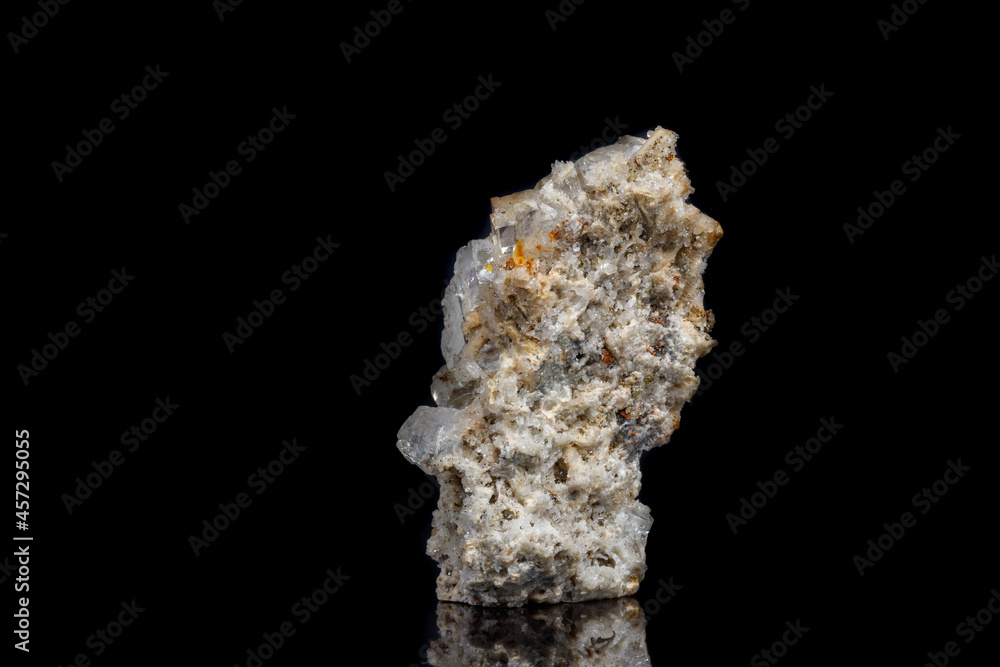Macro mineral stone fluorite with quartz against black background Macro mineral stone fluorite with quartz against black background