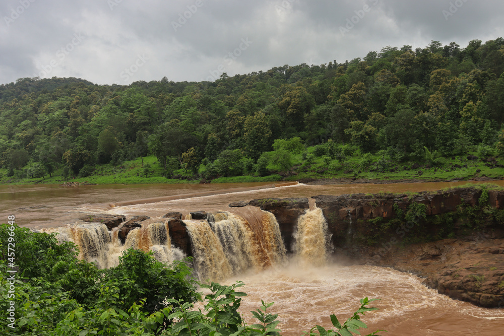 Top View of Gira Waterfall Waghai-Saputara, Gujarat- India. Waterfall surrounded with Beautiful Greenery Top View of Gira Waterfall Waghai-Saputara, Gujarat- India. Waterfall surrounded with Beautiful Greenery