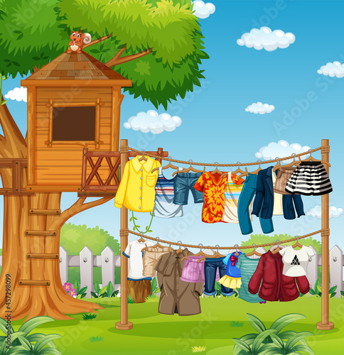 Many clothes hanging on a line outside the house