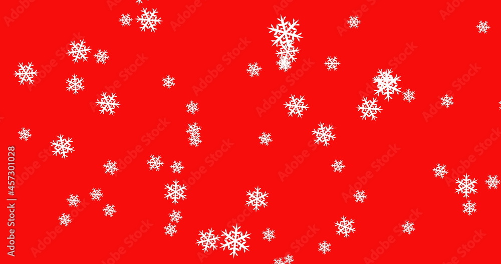 Snowflakes falling against red background