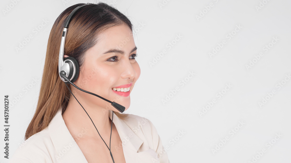 Customer service operator woman in suit wearing headset over white background studio. Customer service operator woman in suit wearing headset over white background studio.