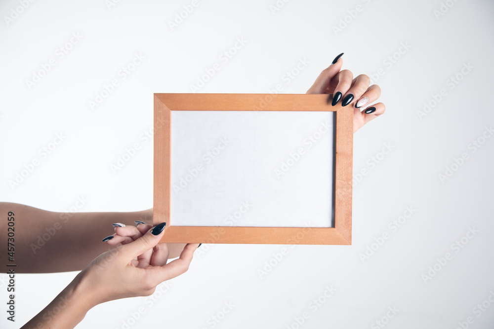 Woman hand holding photo frame. Woman hand holding photo frame.