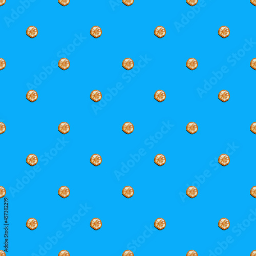 Small pancakes on blue background. Seamless patterns.