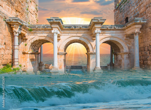 Fototapeta Naklejka Na Ścianę i Meble -  View of Hadrian's Gate in old city of Antalya amazing beach at sunset in the foreground