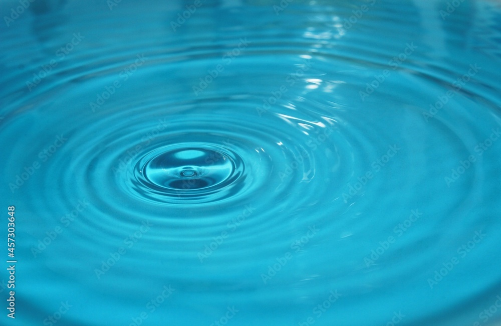 water drop splash background blue, water ripple and antibubble drop - water surface tension 