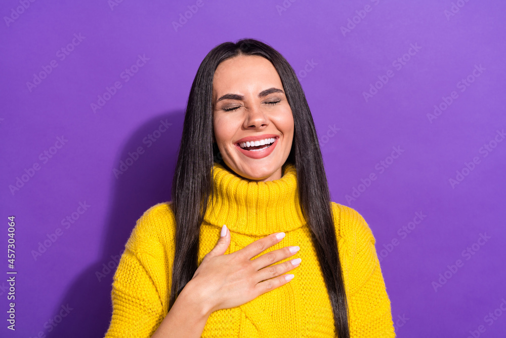 Portrait of satisfied person closed eyes hand on chest laughing wear knitted isolated on purple color background Portrait of satisfied person closed eyes hand on chest laughing wear knitted isolated on purple color background
