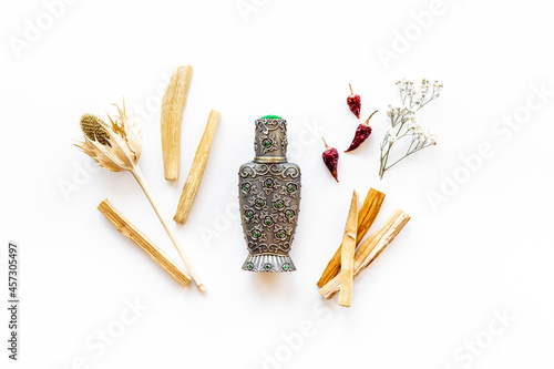 Arabian oud perfume or oil with agar wood tree.  photo