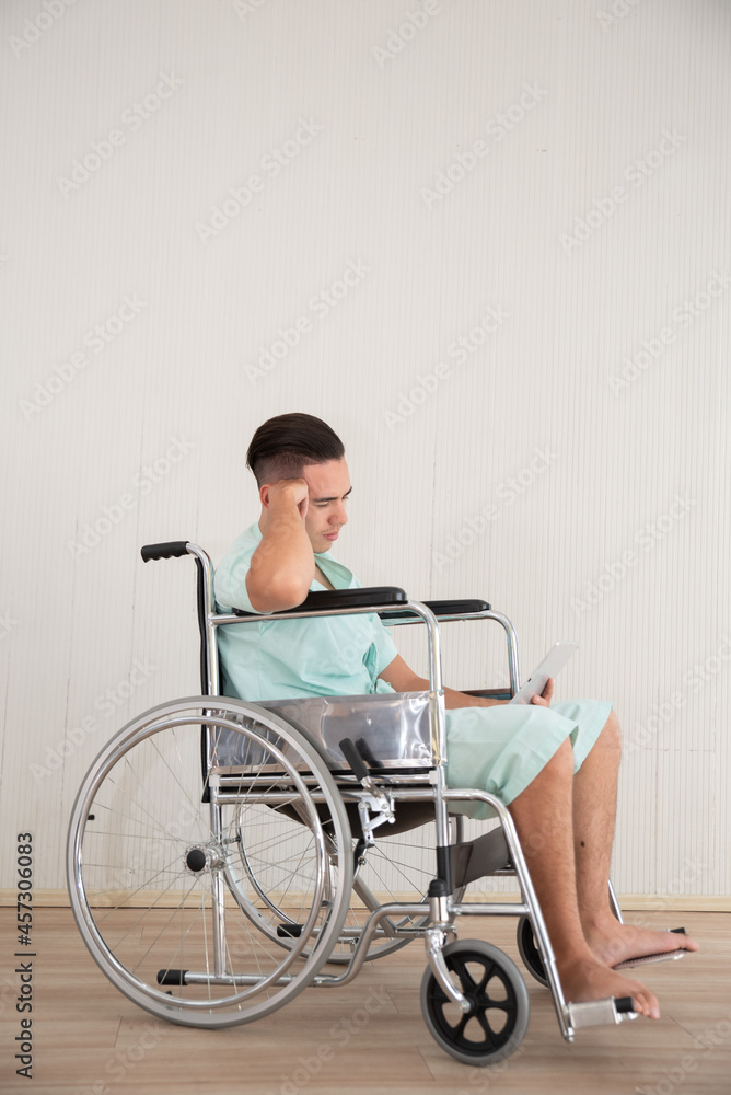Young Man Sitting In Wheelchair At Hospital Young Man Sitting In Wheelchair At Hospital