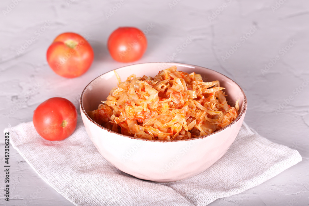 cabbage stewed with tomato is on the table cabbage stewed with tomato is on the table