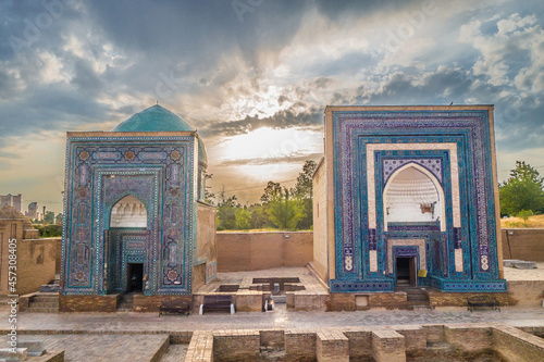 Mausoleums of Shakhi-Zinda complex at sunset time, Samarkand, Uzbekistan. On left is facade of mausoleum of Usto Ali, on right is an unnamed one (belongs to an unknown person) photo