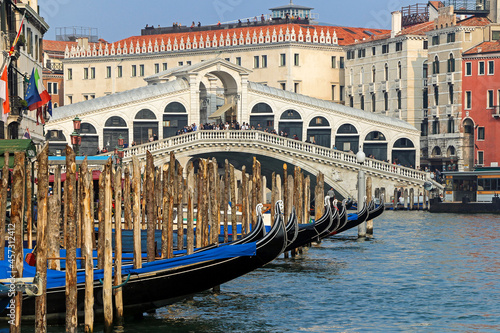 Gondolas, Grand Canal and Rialto bridge in a romantic view of Venice
