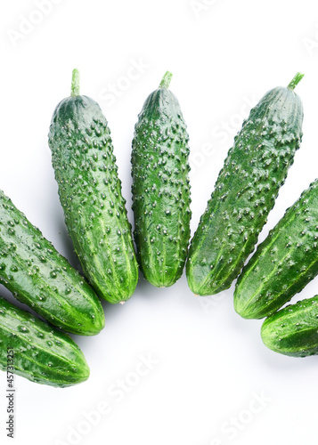 Set of fresh whole cucumbers on white background, food pattern. Garden cucumber wallpaper backdrop design