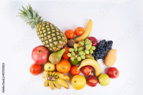 Fototapeta Naklejka Na Ścianę i Meble -  Mix of fresh juicy colorful exotic tropical fruits on white background top view