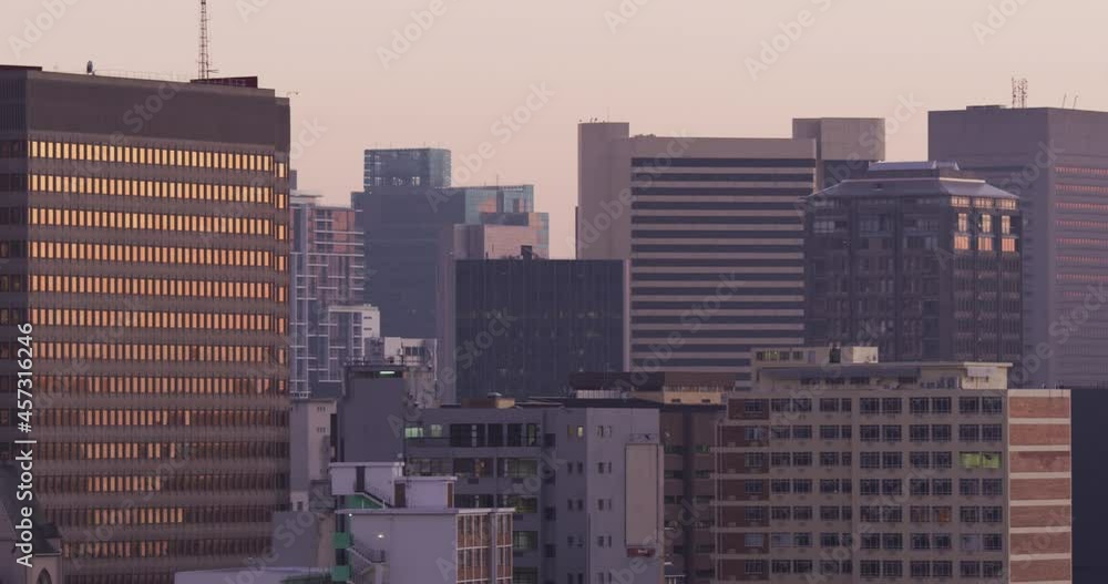 General view of cityscape with multiple tall skyscrapers and buildings