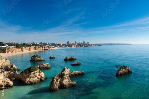 Scenic view of the Alemao Beach (Praia do Alemao) in Portimao, Algarve, Portugal; Concept for summer beach vacations and travel in Portugal photo