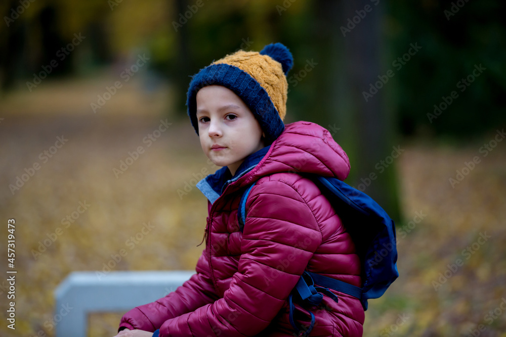 Preschool child, boy, sneezing in park, flu season Preschool child, boy, sneezing in park, flu season