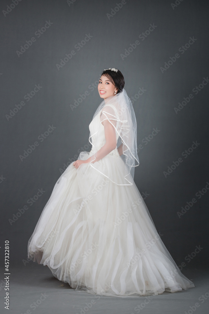 portrait of beautiful bride wearing white wedding dress