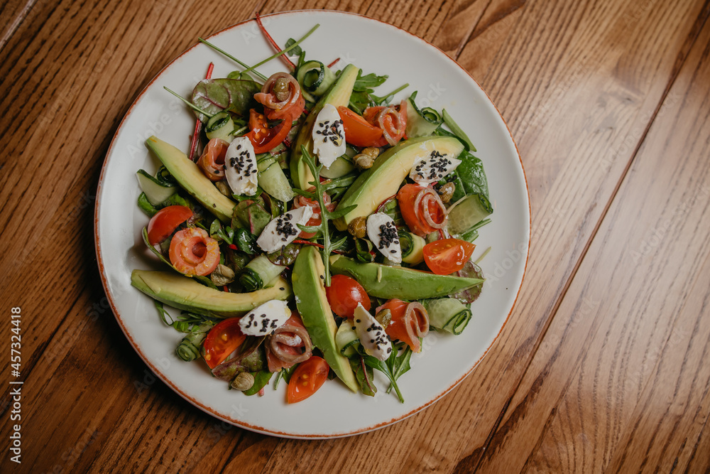 salad with salmon, avocado and cheese
salad with salmon, avocado and cheese