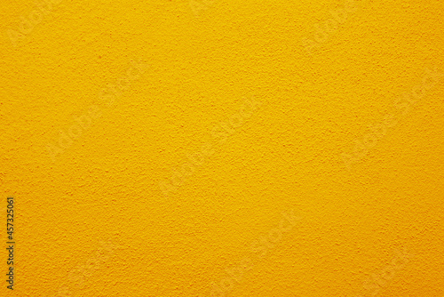 Seamless texture of orange cement wall a rough surface, with space for text, for a background..