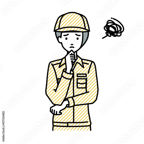 立って手をあごにあてて困っている作業員の女性