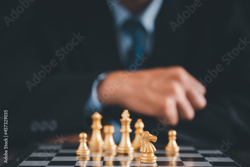 Wallpaper Mural Businessman moves chess with hand.Strategic planning concept about mistakes topple the opposing team and analyze the development for the success of the organization. Torontodigital.ca