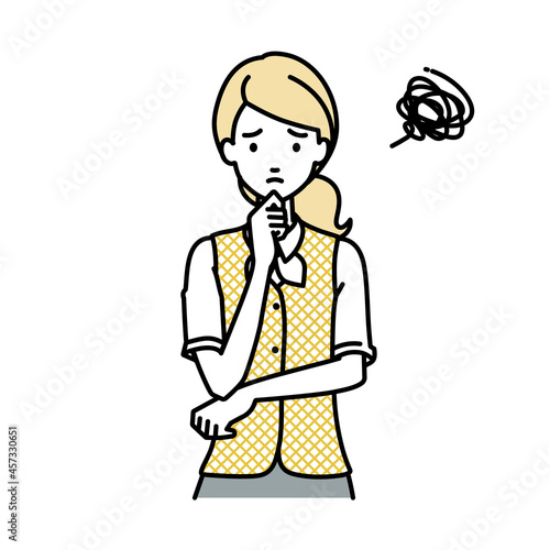立って手をあごにあてて困っている事務員制服の女性