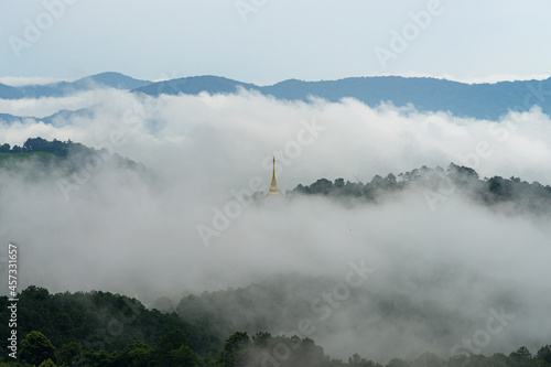 Temple, Santi Tham pagoda or stupa in fog ,Mae Salong, Chiang Rai, Thailand