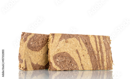 Pieces of sweet halva with chocolate, close-up, isolated on white.
