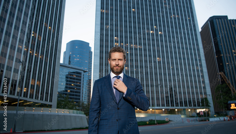 successful man in businesslike suit. manager executive outside the office. male formal fashion successful man in businesslike suit. manager executive outside the office. male formal fashion
