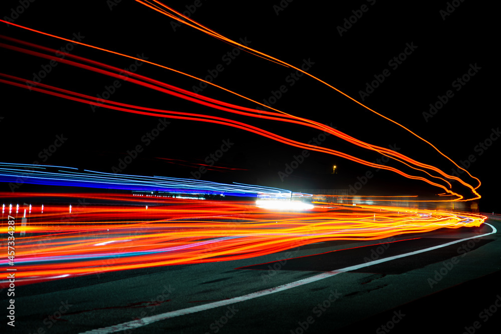 Night road lights. Lights of moving cars at night. long exposure red, blue, green Night road lights. Lights of moving cars at night. long exposure red, blue, green