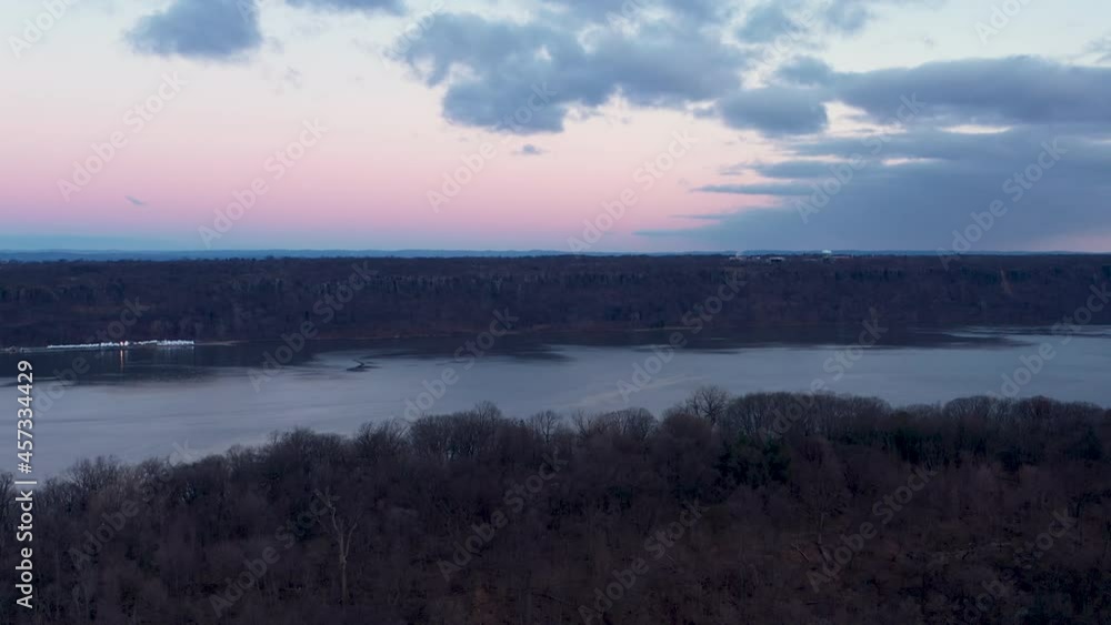 Aerial shot overlooks the Hudson River and Palisades of New Jersey from the New York City side, in winter. Aerial shot overlooks the Hudson River and Palisades of New Jersey from the New York City side, in winter.