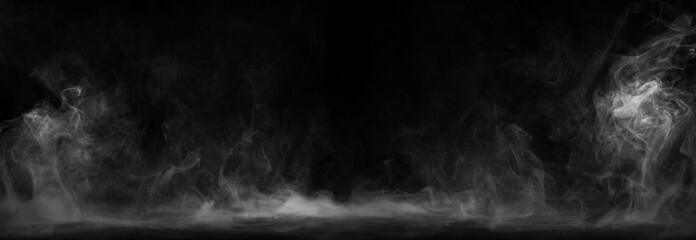 Panoramic view of the abstract fog. White cloudiness, mist or smog moves on black background. Beautiful swirling gray smoke. Mockup for your logo. Wide angle horizontal wallpaper or web banner.