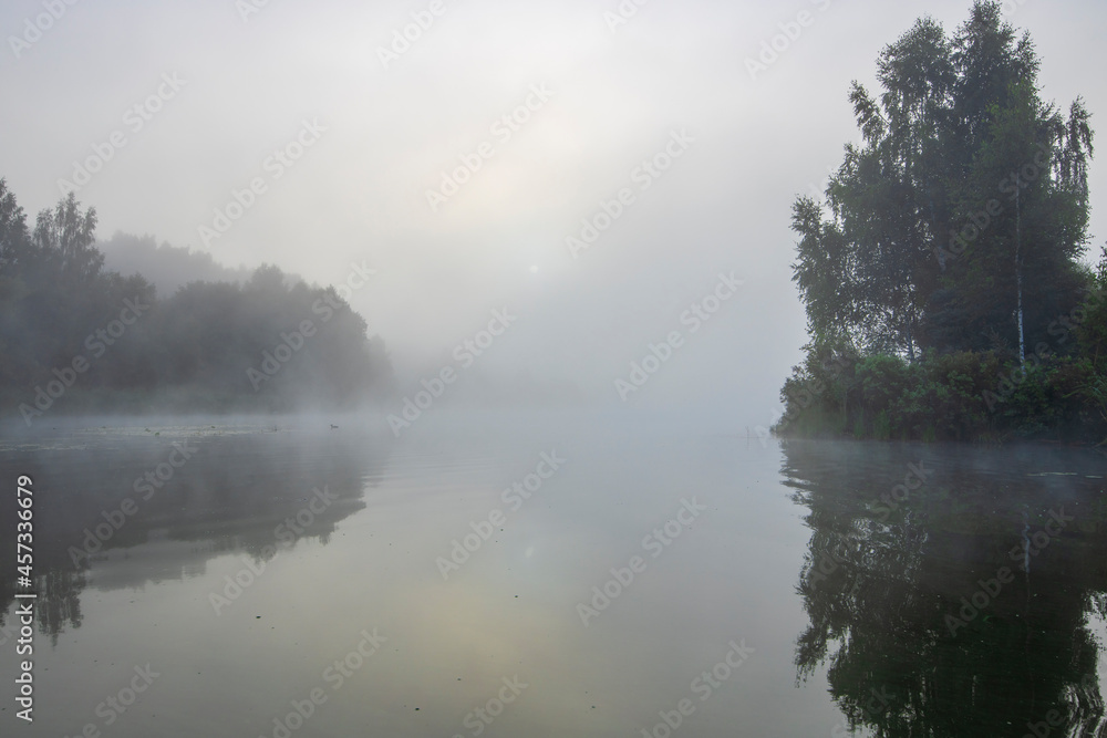 Early morning. Fog on the river. Beautiful sunrise in the summer by the river. Mystical morning on the river