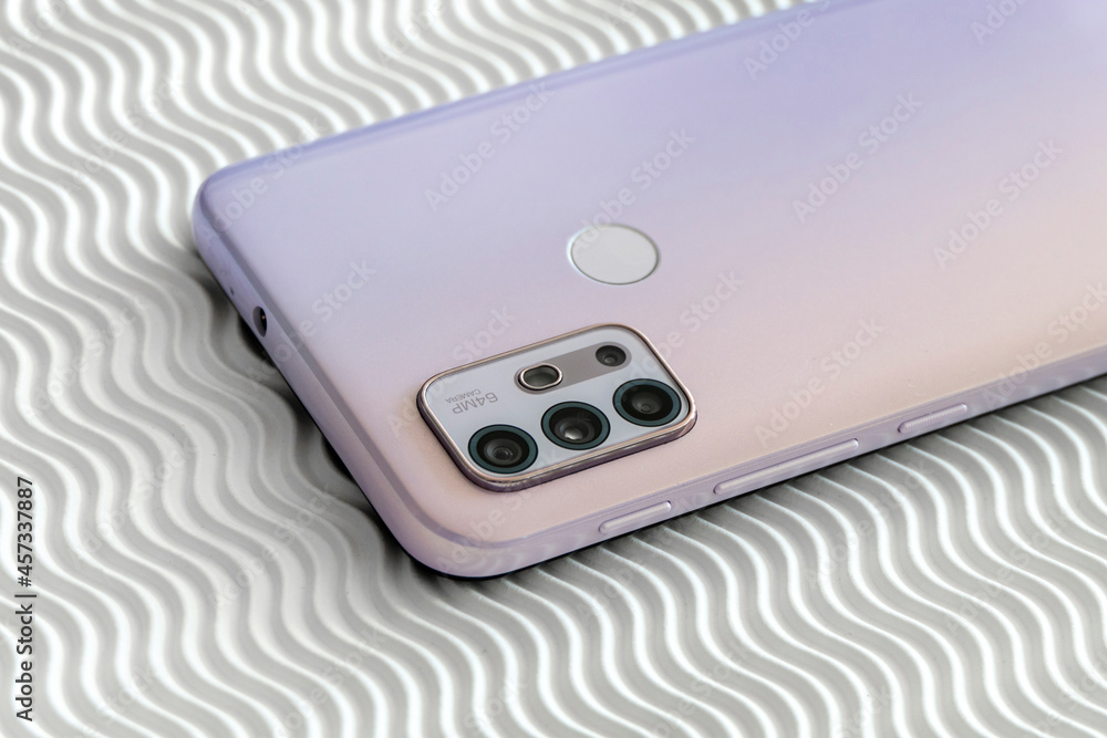 Fototapeta premium Modern Pink Smartphone Back on White Background