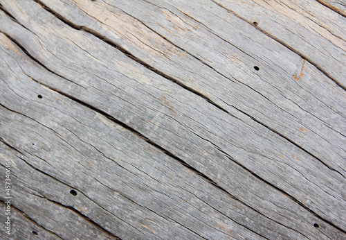 the texture of gray wood with cracks