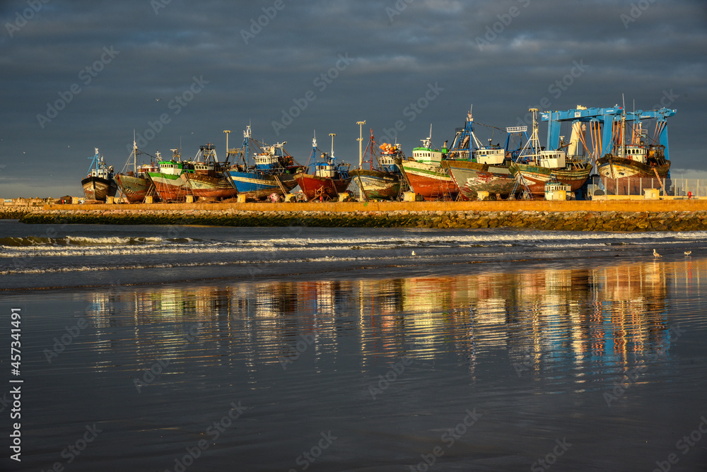 Ships docked in the port of Essaouira at sunrise