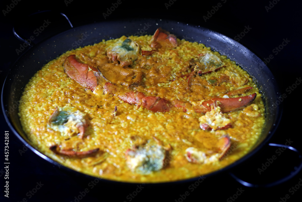 paella de marisco con bogavante y marisco en paella Stock Photo Adobe